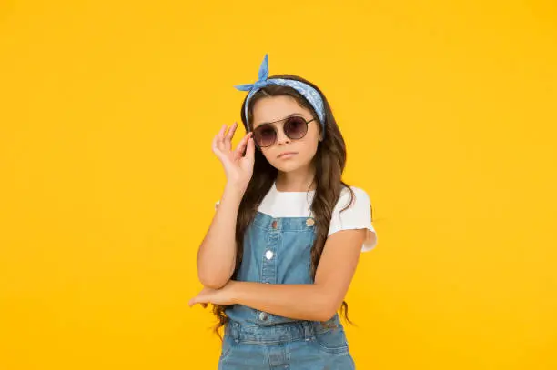 summer goodness. headkerchief and sunglasses - summer accessory. beauty and fashion. happy childhood. retro girl with serious look. small kid wear summer outfit. pretty child has vintage look.