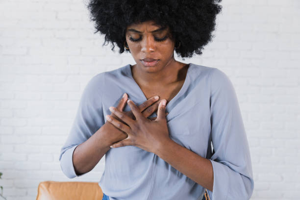 istock Woman holds heart 1382525451