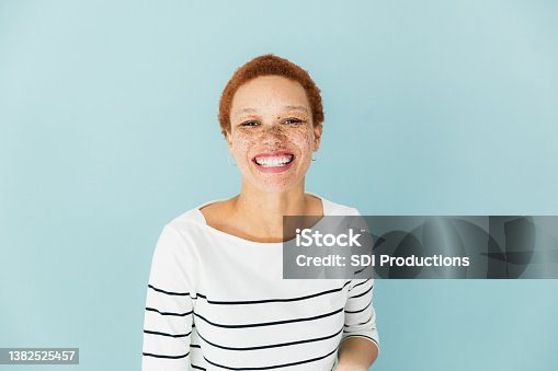 istock Woman in striped shirt 1382525457