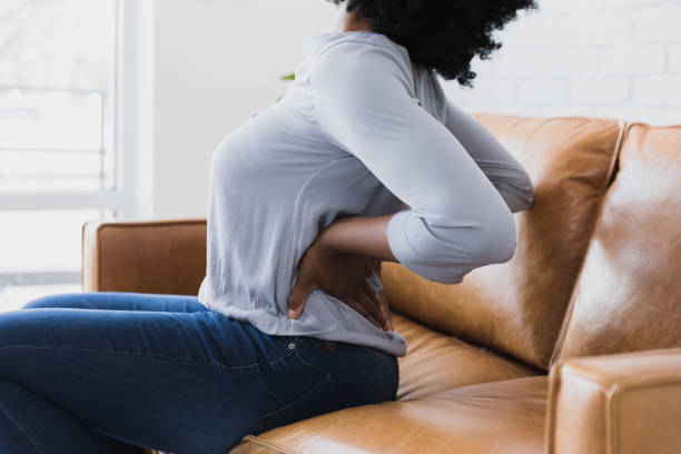 istock Unrecognizeable woman with back pain 1382525458