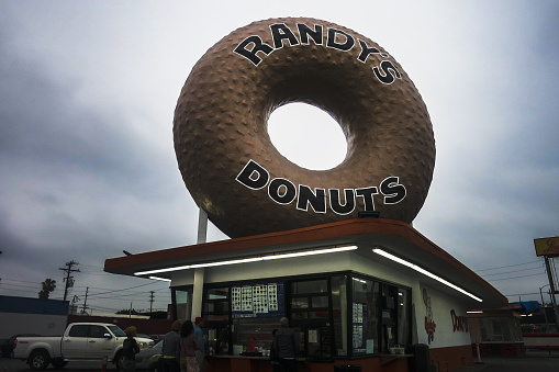 Inglewood, CA. Apr 28, 2019: Randy's Donuts is one of Los Angeles' most iconic landmarks. There is a large donut on the roof of the building. People are always lined up.