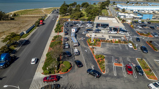 Richmond California, USA - March  7, 2022: Customers waiting in a long line to purchase gasoline at Costco as prices spiked higher on Monday, leading the national average to above $4.00 a gallon.