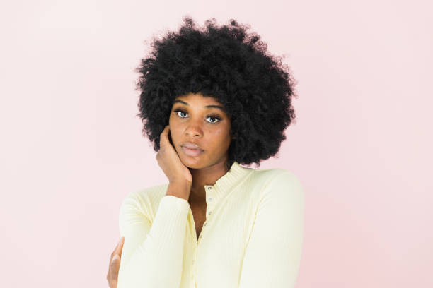 istock Looking at camera, serious woman rests head on hand 1382551331