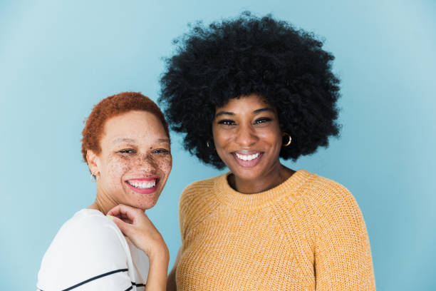 istock Studio shot two women smiling and looking at camera 1382551360