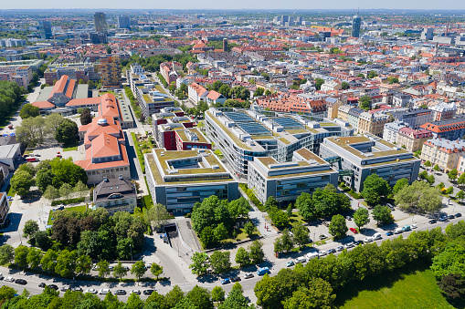Aerial view of a downtown district with apartment houses and a church, Munich, Bavaria, Germany.