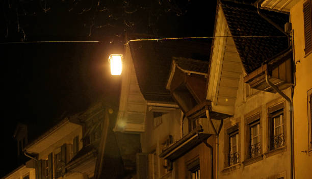 roofs of old city buildings at night