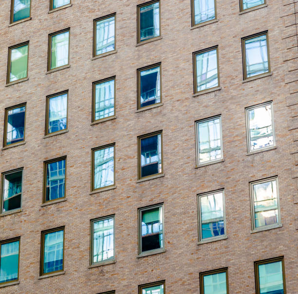 istock high older brick buildings in New York 1382558601
