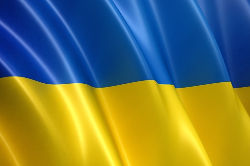 Flag of Ukraine against the blue sky close-up. National pride and symbol of the country Ukraine. War in Ukraine. Yellow-blue flag.
