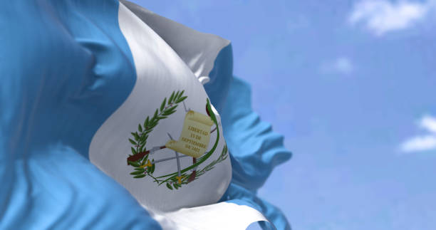 Detail of the national flag of Guatemala waving in the wind on a clear day Detail of the national flag of Guatemala waving in the wind on a clear day. Guatemala is a country in Central America. Selective focus. puerto quetzal guatemala stock pictures, royalty-free photos & images