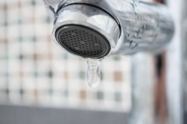 istock Close up faucet with water drop 1382626467