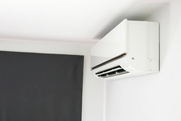 istock Air conditioner on white wall room interior background 1382626488
