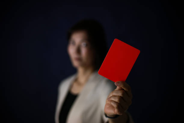istock Female employee issuing a red card 1382632708