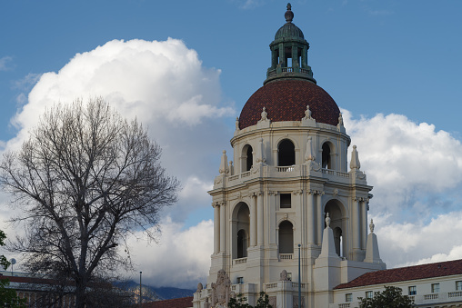 Image showing the iconic Pasadena City Hall in Los Angeles county. Image taken against a cloudy sky after a storm. This landmark is listed in the National Register of Historic Places.