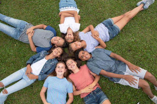 istock Teenagers Outside in the Grass 1382646556