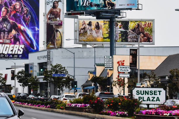 Billboards line up  the Sunset Plaza of Sunset Blvd in California. Los Angeles CA,USA. Apr 27,2019: Media billboards on the buildings at West Hollywood neighborhood.
 This located at Sunset Plaza,  Sunset Boulevard in the Sunset Strip, in West Hollywood, California. sunset strip stock pictures, royalty-free photos & images