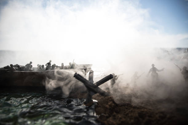 world war 2 reenactment (d-day). creative decoration with toy soldiers, landing crafts and hedgehogs. battle scene of normandy landing on june 6, 1944. - normandiya stok fotoğraflar ve resimler