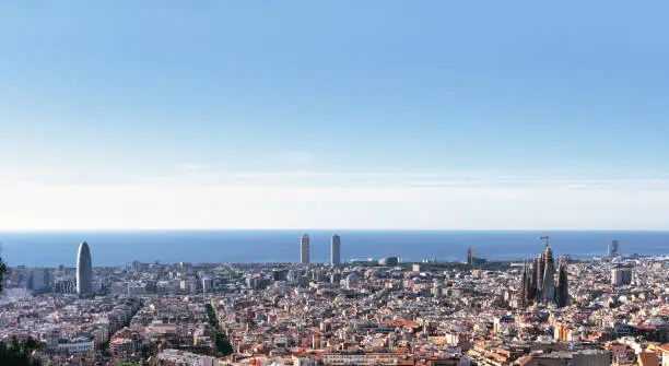 Photo of Barcelona city skyline with Mediterranean sea and blue sky - Spain.