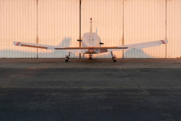 istock Small plane parked in front of hangar, San Francisco, California 1382654862