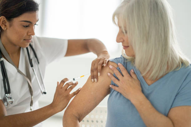 istock Senior Receiving a Vaccine 1382661922