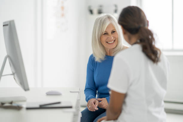 istock Doctor Meeting with a Senior in Her Office 1382661925