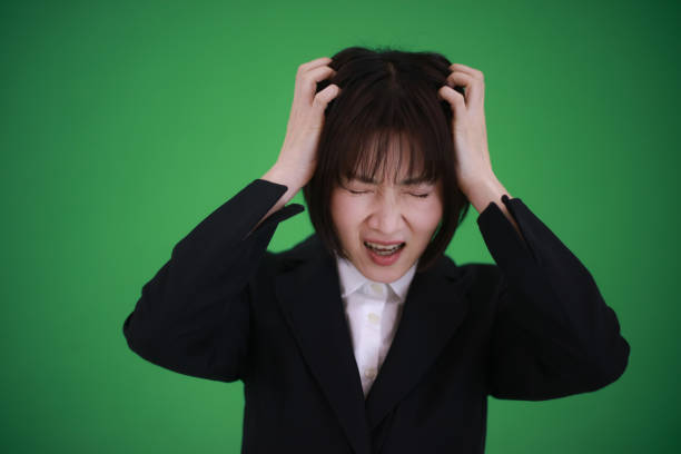Female employee holding a head