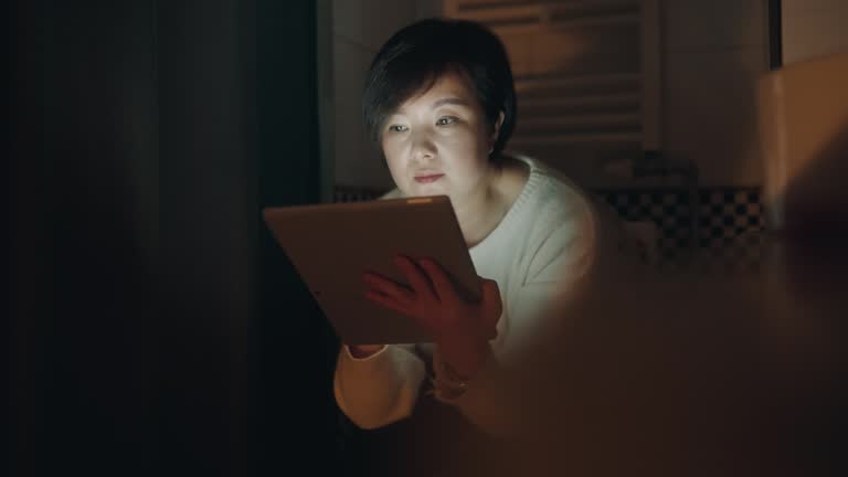 Women use tablets in the bathroom