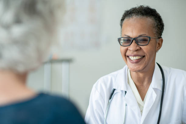 istock Female Doctor with a Senior Patient 1382698838