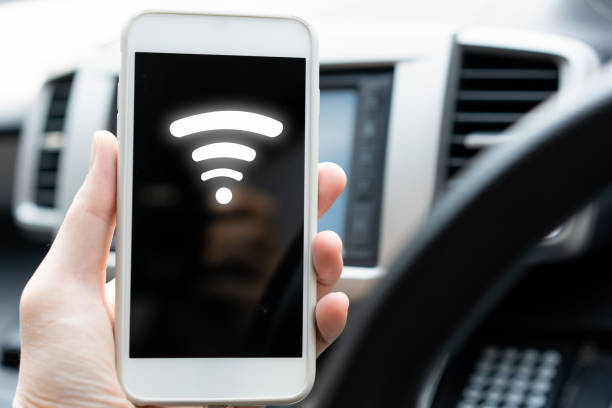 istock hand hold mobile phone with wifi signal in screen for connect 1382699185