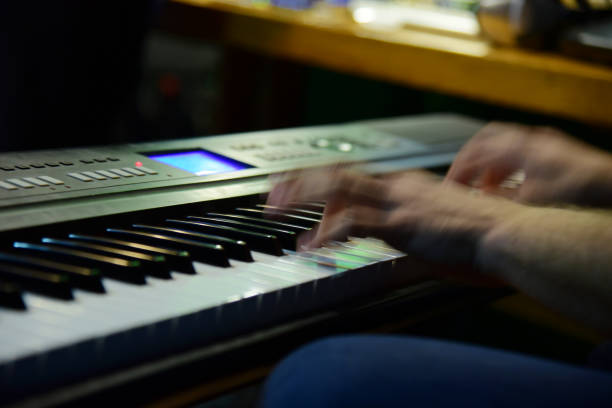 istock Fingers hands man play musical instrument 1382702192