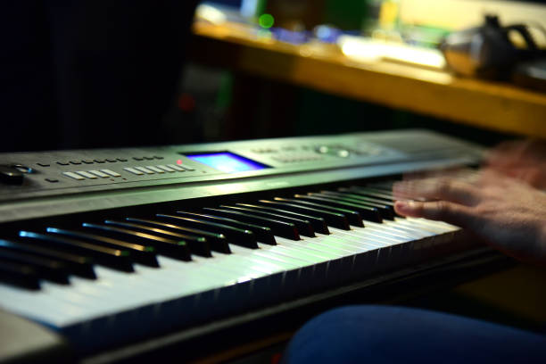 istock Fingers hands man play musical instrument 1382702220