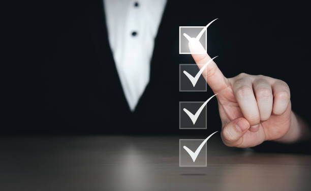 istock businessman's hand checks virtual checkmark. 1382703146