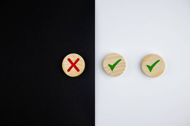 istock cross and a check mark on wooden cube. 1382703267