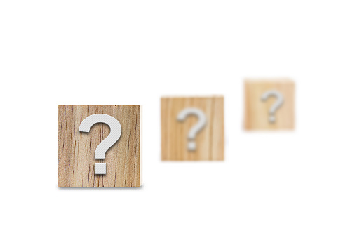 wooden question mark. frequently asked questions marketing plan for educational ideas and Q and A