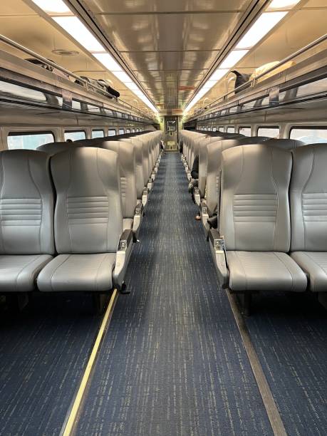 Empty Amtrak Rail Car Interior view down the aisle of an empty Amtrak rail car. Amtrak stock pictures, royalty-free photos & images