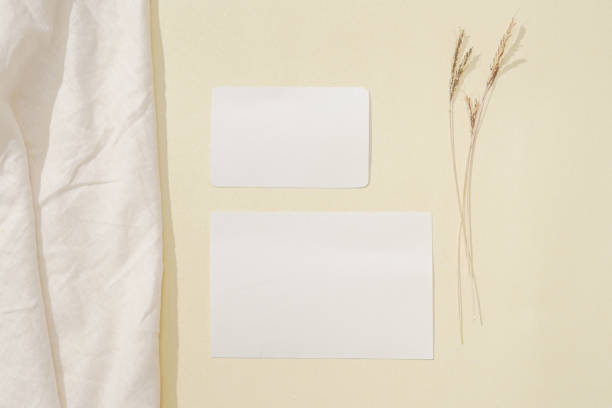 istock rustic blank cards on a fabric. a layout composition for a copy space background. minimalist flat lay mockup. 1382707575