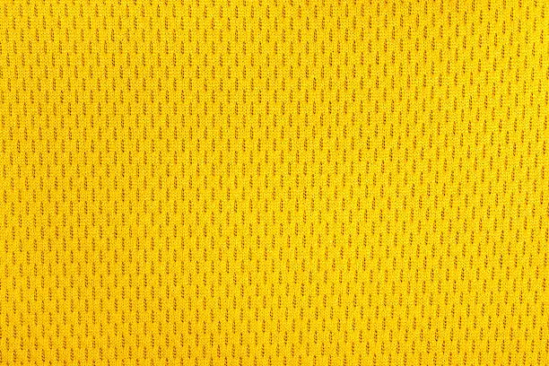 yellow polyester nylon sportswear shorts to created a textured background.