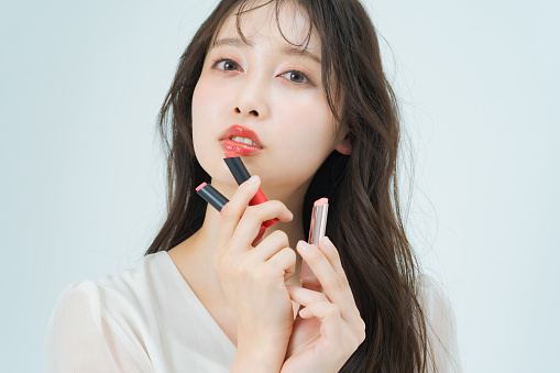 Young woman with make-up and lipstick and white background