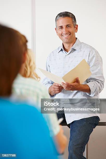 Tutor With Class Of Students Stock Photo - Download Image Now - Professor, Student, Talking