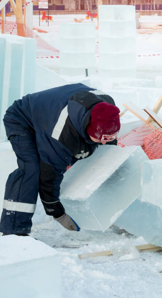 istock The fitter drags an ice block with his hands 1382772258