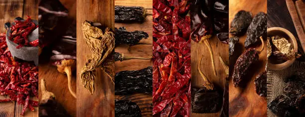 Panoramic collage of different assortment of mexican dried chili peppers. Chile Morita, Guajillo, de arbol, Chipotle and Pasilla. Used in a variety of Mexican preparations.