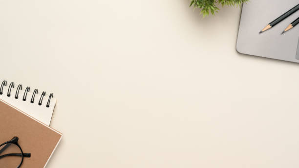 istock Simple white workspace with copy space and laptop mockup. top view 1382782725