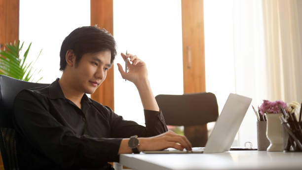 istock Focused businessman concentrated working on laptop. 1382783287