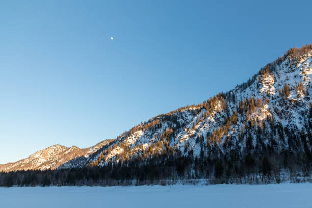istock Sunny afternoon at frozen lake Mittersee 1382784091