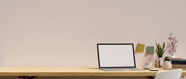 istock Close-up, Open laptop computer mockup and copy space on wooden table 1382784474