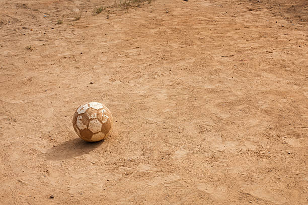 istock Poor school playground with an old soccer ball 138278537