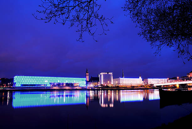 Wolfsburg, Germany - dec 22th 2019: Volkswagen Arena, Volkswagen car plant chimneys and Autostadt towers are illuminated for holiday season.