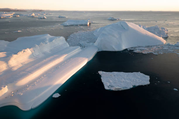 istock Big icebergs floating over sea from aerial view 1382792668