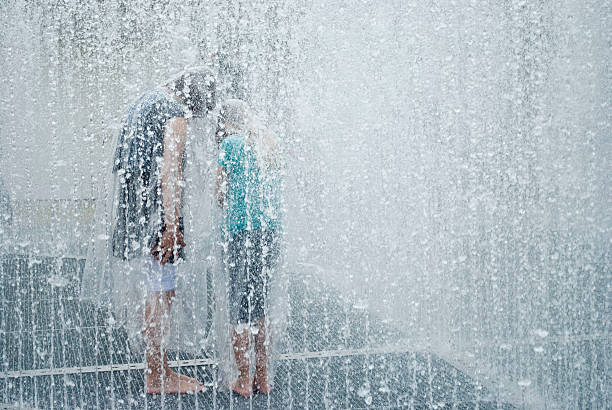 Kids playing with a fountain at cultural festival \