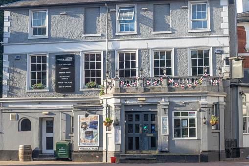 Warwick Park at Royal Tunbridge Wells in Kent, England, with a gastro pub and St George's flag bunting visible.