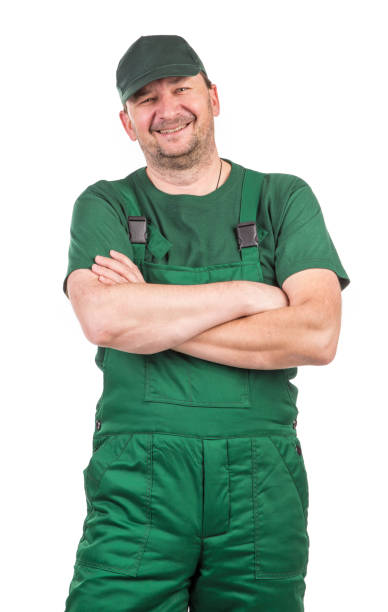 istock Worker in green overalls. 1382813733